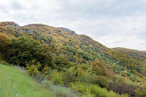 The bare summit block of Stony Man above the autumn colour in Shenandoah