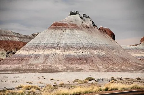 Cone-shaped striped badland mounds called The Tepees beside the park road, Petrified Forest National Park.