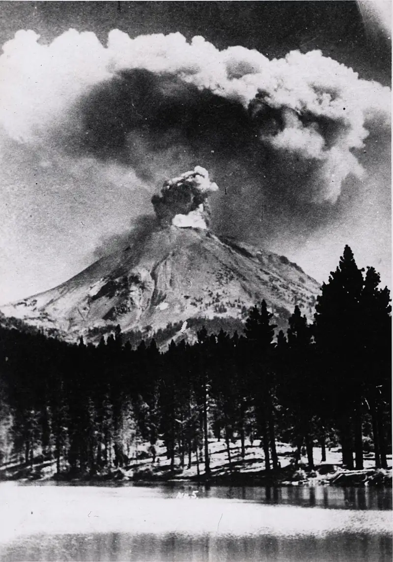 A tall column of ash and steam rises from erupting Lassen Peak in 1915.