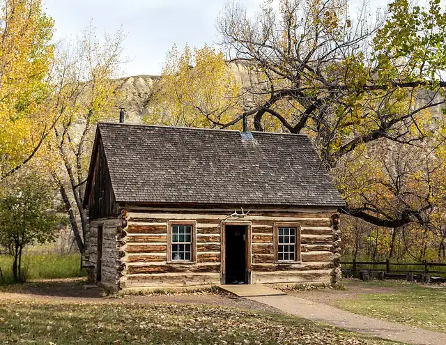 Theodore Roosevelt's 1883 Maltese Cross Cabin, a log ranch cabin beside the South Unit Visitor Center in Medora, North Dakota.