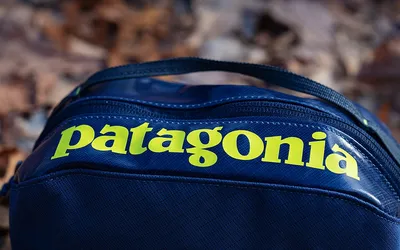 A zippered fabric packing cube in dolomite blue, the kind used to sort clothes inside a duffel.
