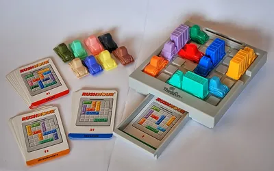 Rush Hour, a sliding block puzzle whose plastic cars box one another in on a grid.
